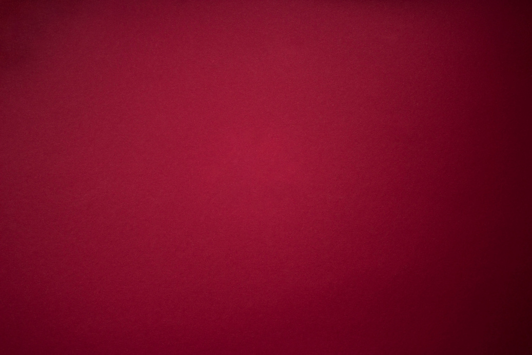 Burgundy Red Striped Paper Texture Background. Purple red grunge wall background with dark spots.